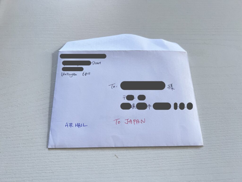 The photo of an envelope with the recipient's address in the centre and the sender's address in the upper left.